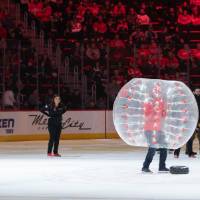 Alumni play a game together at the Detroit Red Wings GVSU Night